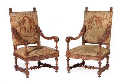 Lot 732 - A Pair of Late 19th Century Carved Walnut Baroque Style Armchairs, upholstered in brass studded...