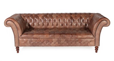 Lot 740 - A Victorian Style Buttoned Brown Leather Chesterfield Sofa, modern, with rounded arms and...