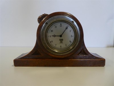 Lot 2084 - Robert Mouseman Thompson (1876-1955): An English Oak Mantel Clock, the case with triangular...