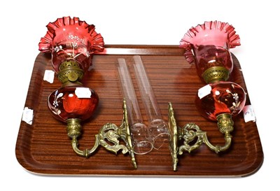 Lot 3 - A pair of Victorian cranberry glass oil lamps