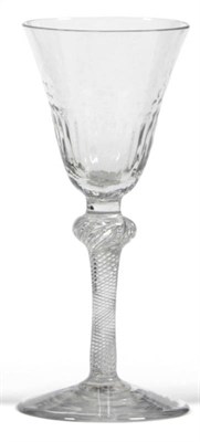 Lot 34 - An Air Twist Wine Glass, circa 1750, the round funnel bowl with dimpled and fluted decoration, on a