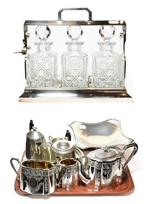 Lot 27 - A Group of silver plate and pewter, including: an oblong tantalus with three cut-glass...