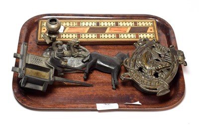 Lot 42 - A primitive carved wood horse and cart, a cast iron money box, a cribbage board, a candlestick with