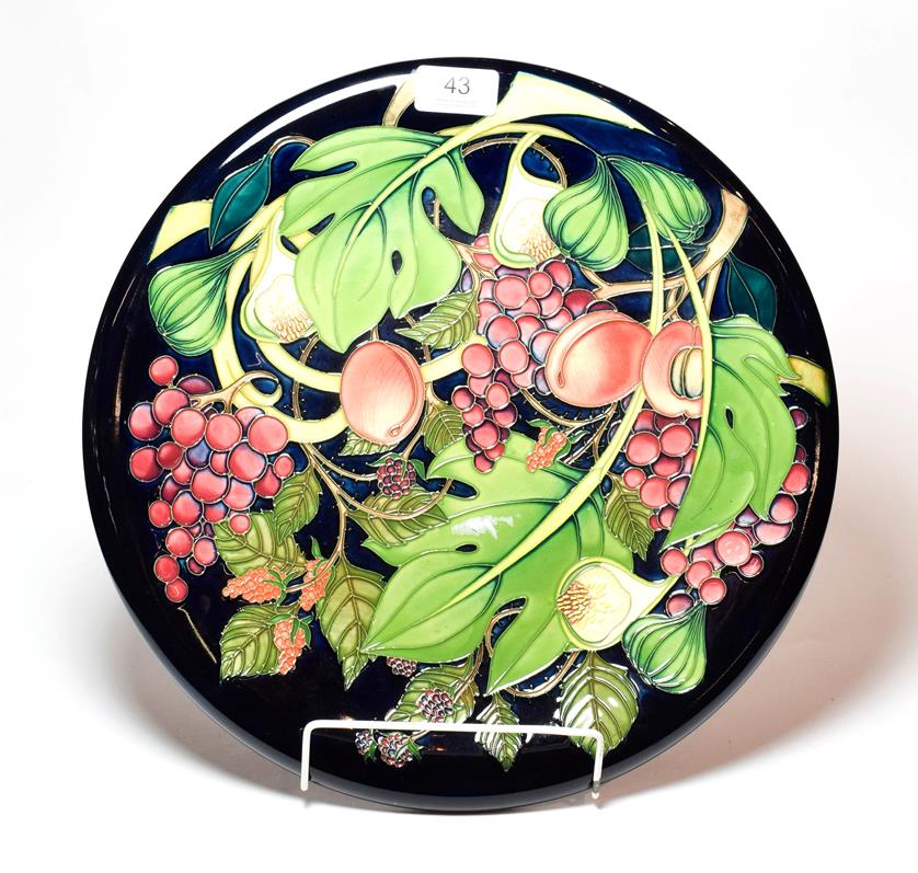 Lot 43 - A Moorcroft Queen's Choice pattern charger, designed by Emma Bossons, 35.5cm diameter.