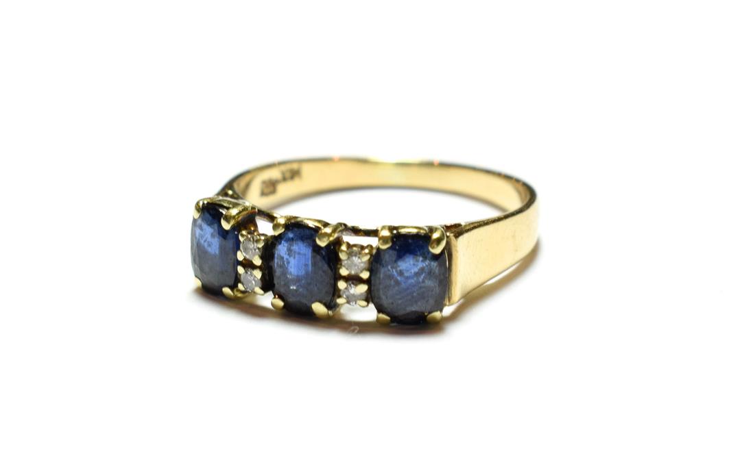 Lot 48 - A sapphire and diamond ring, stamped '585' and '14K', finger size Q1/2