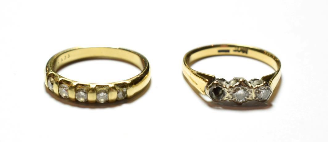 Lot 49 - A diamond five stone ring, stamped '9K', finger size L1/2; and a diamond three stone ring,...