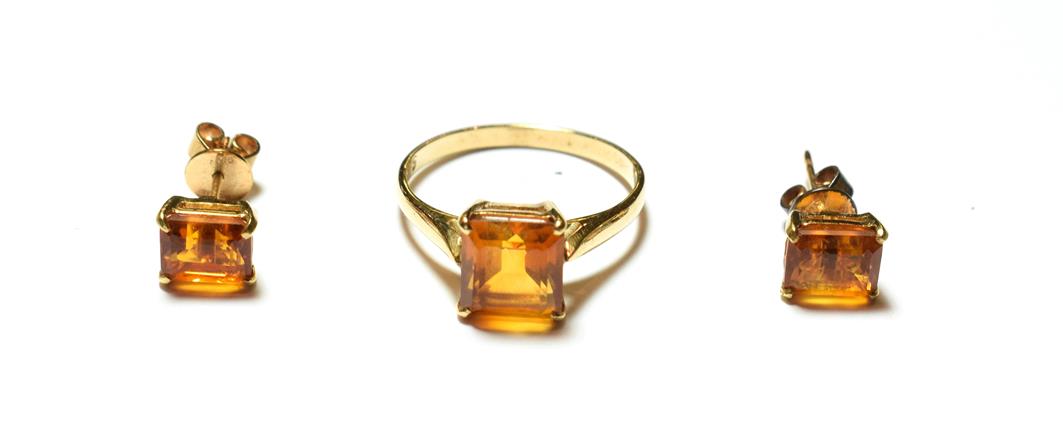 Lot 57 - A citrine ring, stamped '9K', finger size Q1/2; and a pair of matching earrings, unmarked