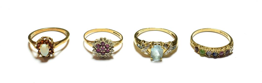Lot 65 - A 9 carat gold opal and garnet cluster ring, finger size P; and three further 9 carat gold gem...