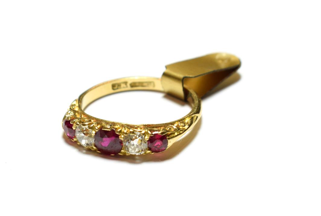 Lot 68 - A synthetic ruby and diamond five stone ring, three graduated round cut synthetic rubies...