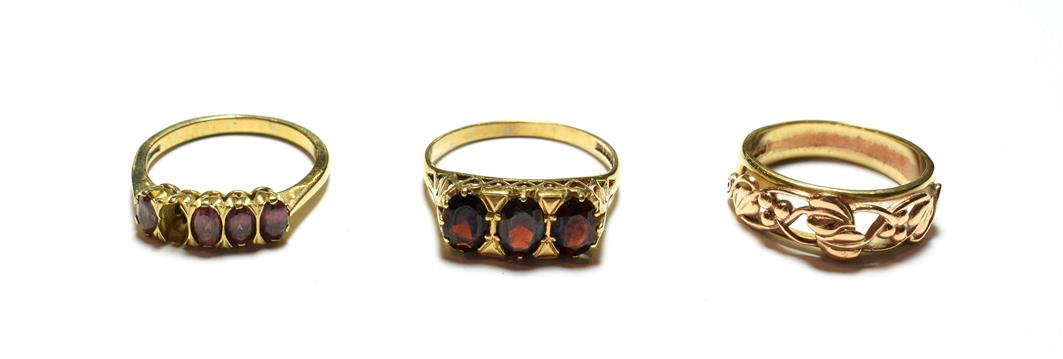 Lot 78 - Three 9 carat gold rings including two garnet examples, various designs and finger sizes (one a.f.)