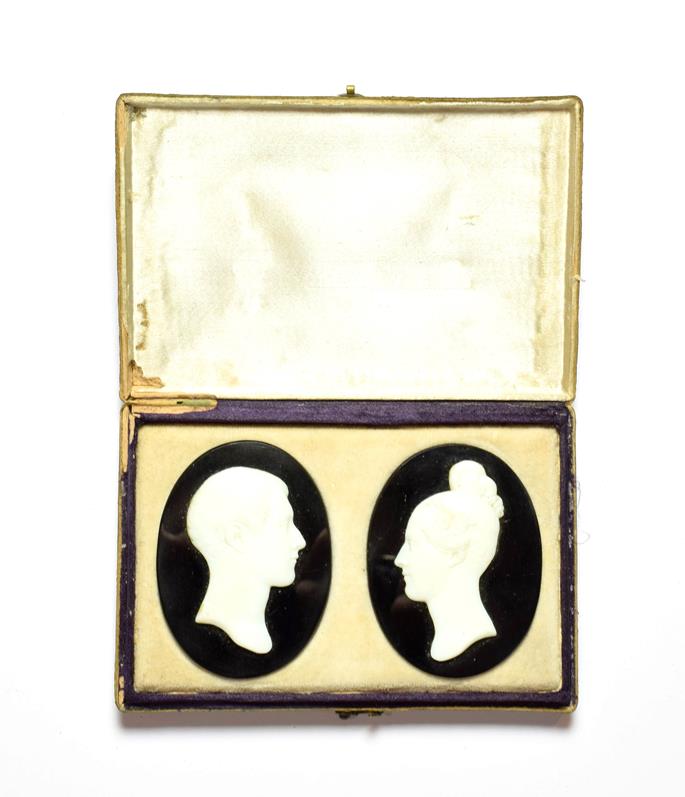 Lot 87 - Two oval jet plaques applied with cameos in profile, cased