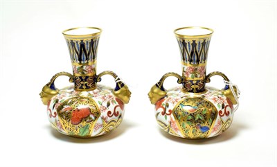 Lot 104 - A pair of Royal Crown Derby Imari pattern twin handled vases (2)