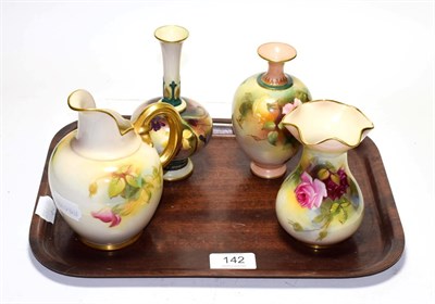 Lot 142 - Three Royal Worcester rose decorated items consisting of two vases and a jug, together with a Royal