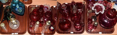 Lot 147 - A quantity of cranberry glass wares, together with a small quantity of art glass (on four trays)