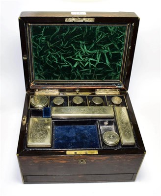 Lot 148 - A Victorian Coromandel vanity case with two secret compartments, fitted interior and accoutrements