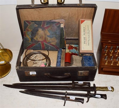 Lot 243 - Four bayonets and a suitcase of assorted magician's items