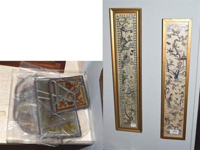 Lot 245 - Two Chinese embroidered silk panels in glazed frames and a small collection of stained glass