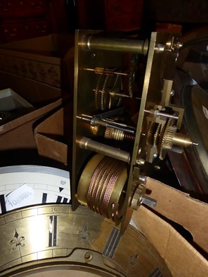 Lot 314 - A burr walnut veneered drop dial wall clock, two single fusee movements, a quantity of clock...