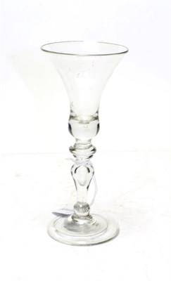 Lot 376 - A baluster wine glass, circa 1740, the bell shaped bowl on an annular knop and baluster stem...