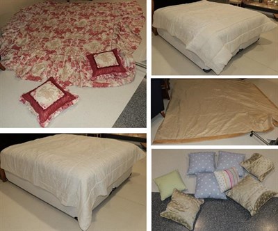 Lot 389 - Assorted bedding and textiles comprising two cream bed spreads, red and white bed cover,...