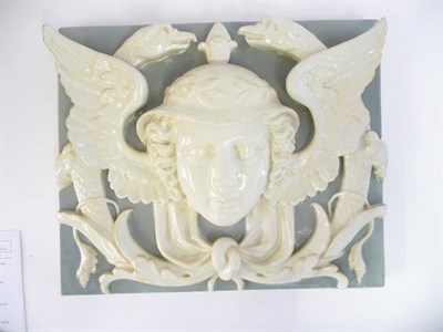 Lot 75 - A Minton Faience Architectural Plaque, circa 1870, modelled in high relief with the mask of Mercury
