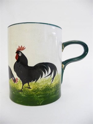 Lot 78 - A Robert Heron "Wemyss Ware" Mug, painted with a black cockerel and three chickens on a sponged...