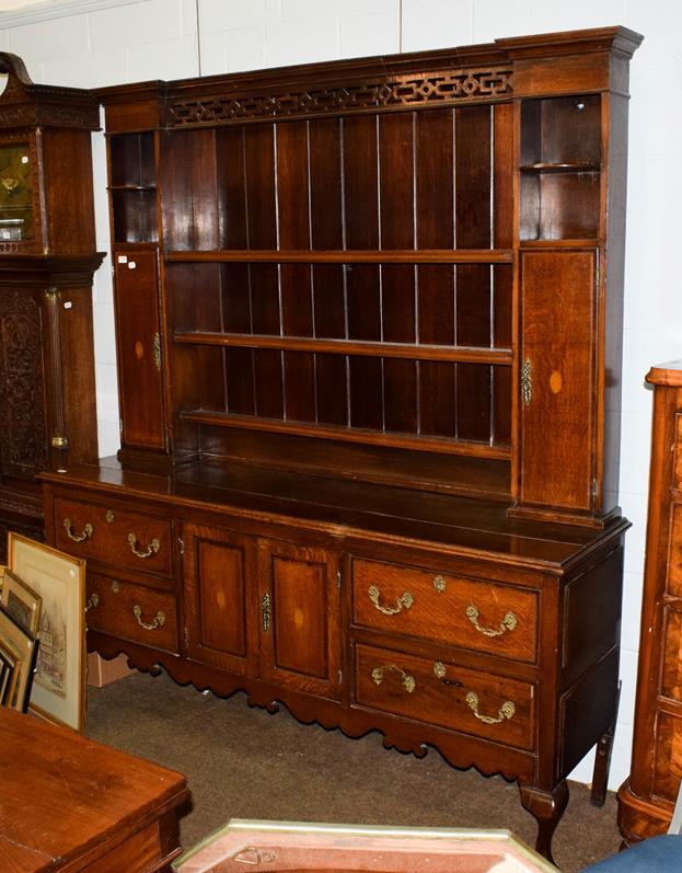 Lot 1085 - A George III checkered inlaid oak dresser and rack, the upper section with pierced fretwork,...