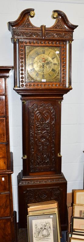 Lot 1086 - A carved oak thirty hour longcase clock, the square brass dial signed Ewbank, Elland