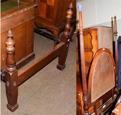Lot 1104 - An Edwardian mahogany single bed with reeded columns and acorn finials, with a caned headboard