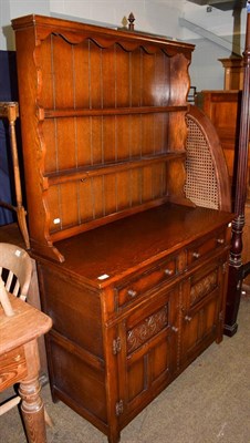 Lot 1106 - A 20th century oak dresser and rack, bearing label J H Hesketh & Son. Ltd. Burnley, 107cm by...