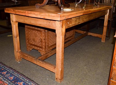 Lot 1125 - A pine farmhouse kitchen table, with refectory base and chamfered legs, 179cm by 87cm by 76cm