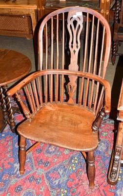 Lot 1129 - A 19th century yew wood and elm Windsor chair