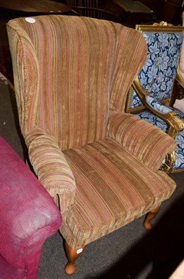 Lot 1143 - A Parker Knoll wing back chair