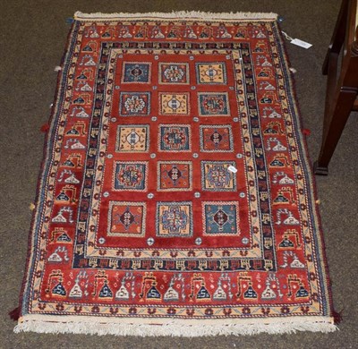 Lot 1155 - Unusual piled and Soumakh rug, probably Kashgai, the terracotta fields with three columns of...