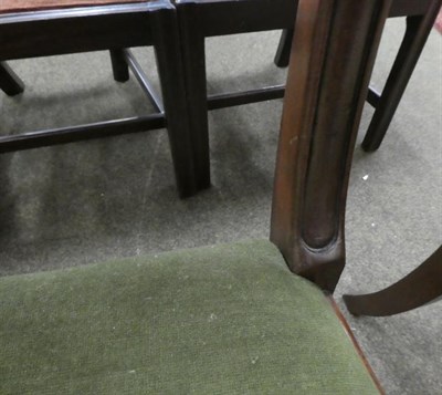 Lot 1165 - A set of four early 19th century mahogany dining chairs on reeded legs