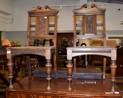 Lot 1184 - A pair of late Victorian hall chairs, by Simpson & Sons of Halifax
