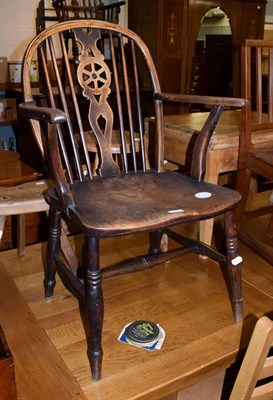 Lot 1193 - A 19th century yew and elm wheel back Windsor chair