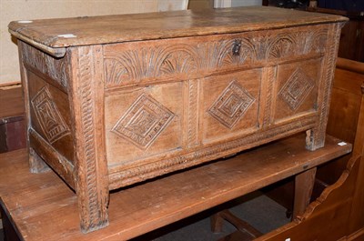 Lot 1207 - A 17th century oak three panel kist, decorated with lozenges and lunettes, 114cm by 48cm by 54cm