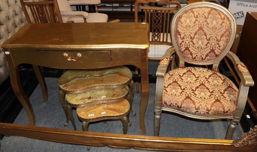 Lot 1232 - A nest of three reniform onyx and gilt metal tables, together with a modern gilt veneered side...