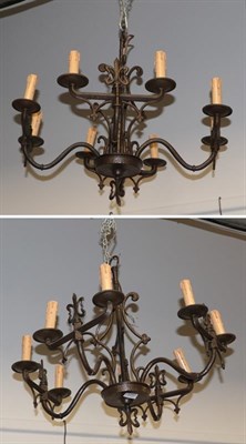 Lot 1247 - A reproduction hammered metal three-branch light fitting with twin candle supports and a larger...