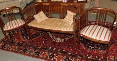 Lot 1250 - An Edwardian inlaid mahogany three-piece salon suite (3)