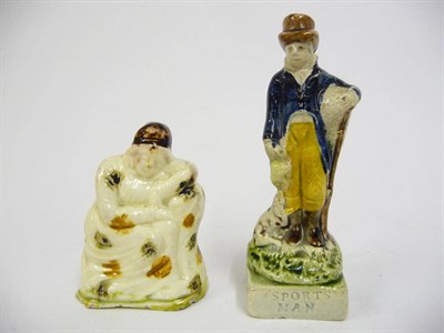 Lot 100 - A Prattware Standing Figure "Sportsman", circa 1810, as a gentleman wearing a brown top hat,...