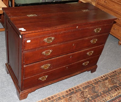 Lot 1255 - A George III oak chest of four drawers, top two dummy, hinged lid, brass swan neck handles, bracket