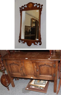 Lot 1272 - A reproduction panelled oak television cabinet, a small oak side table, a Georgian style fret...