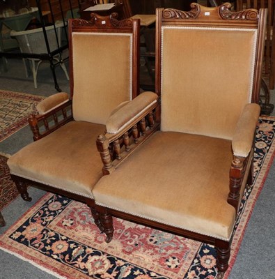 Lot 1275 - A pair of ladies and gentlemans armchairs with carved frames and padded arms