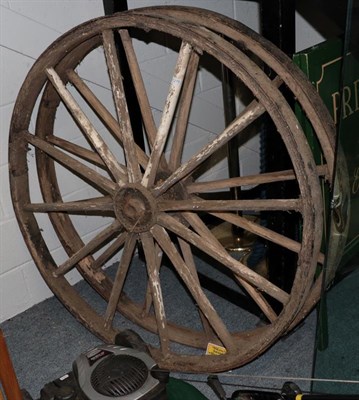 Lot 1279 - A pair of iron bound cart wheels, 124cm diameter