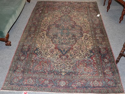 Lot 1288 - Isfahan rug, the central medallion surrounded by scrolling flowering vines, enclosed in a red...