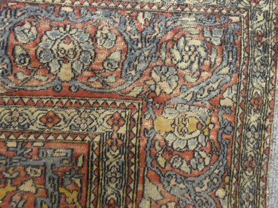 Lot 1288 - Isfahan rug, the central medallion surrounded by scrolling flowering vines, enclosed in a red...