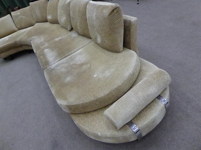 Lot 1303 - A Roche Bobois French curved sofa in gold crushed velvet, 540cm wide by 225cm deep by 167cm