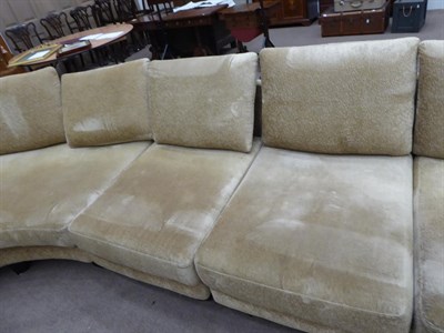 Lot 1303 - A Roche Bobois French curved sofa in gold crushed velvet, 540cm wide by 225cm deep by 167cm